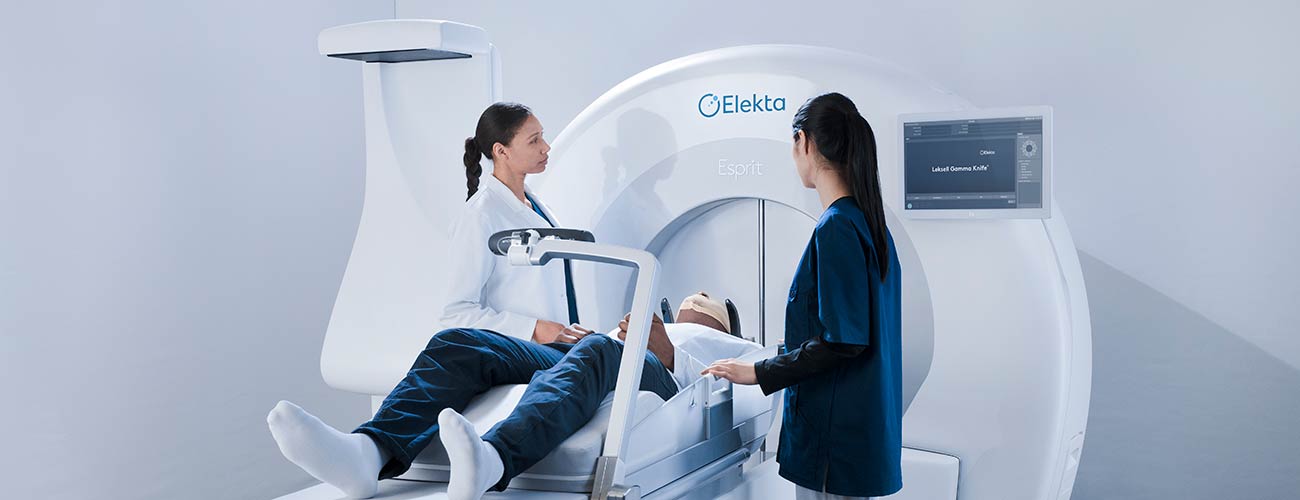 photo of technicians, patient and Elekta Esprit